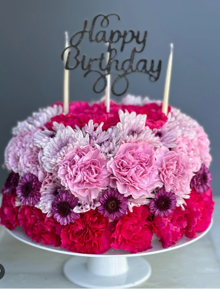 Floral-inspired birthday cake decorated with pastel buttercream blooms on top, perfect for birthday celebrations and Bronx delivery
