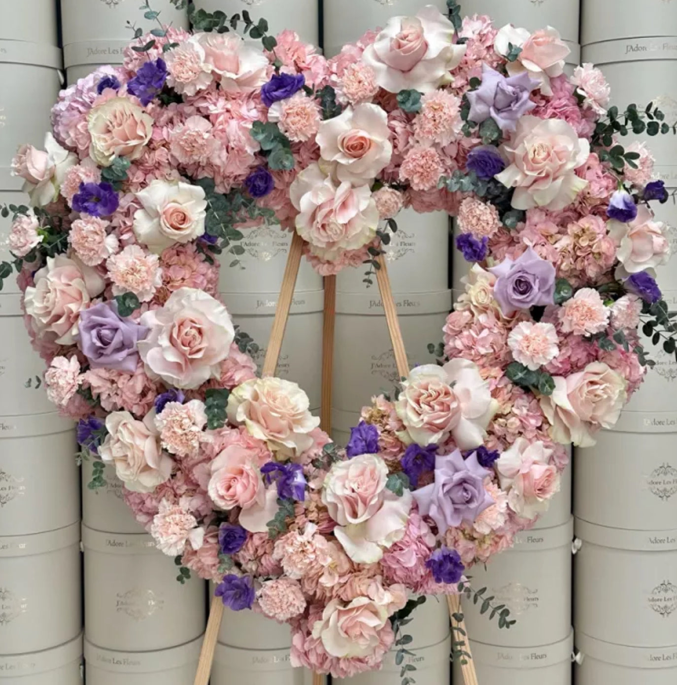 Sympathy flowers with pink roses and lavender blooms – Bronx NY florist