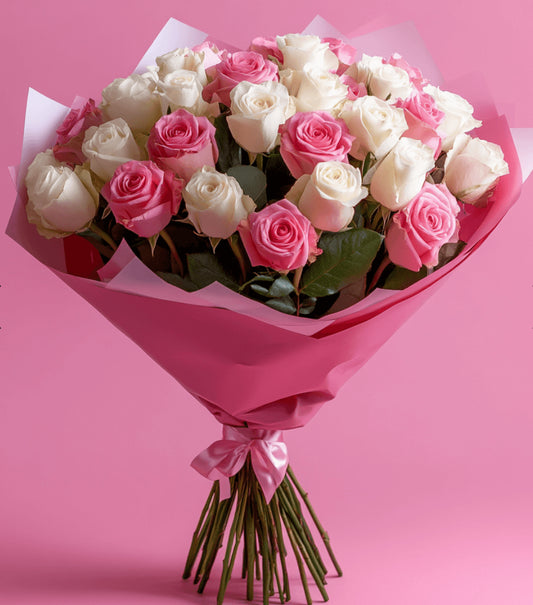 Soft pink and white rose bouquet wrapped in pastel paper with satin ribbon – Cotton Candy Bouquet by 1800 Blooms Bronx NY