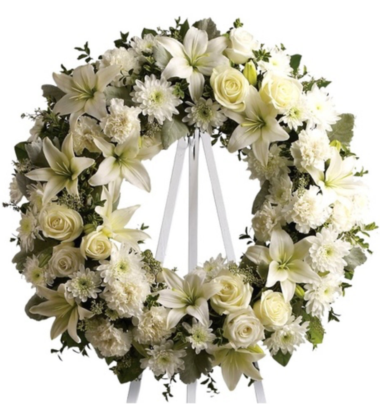 Circular funeral wreath with white lilies, roses, chrysanthemums, and carnations symbolizing peace and remembrance – Eternal Serenity Funeral Wreath by 1800 Blooms Bronx NY