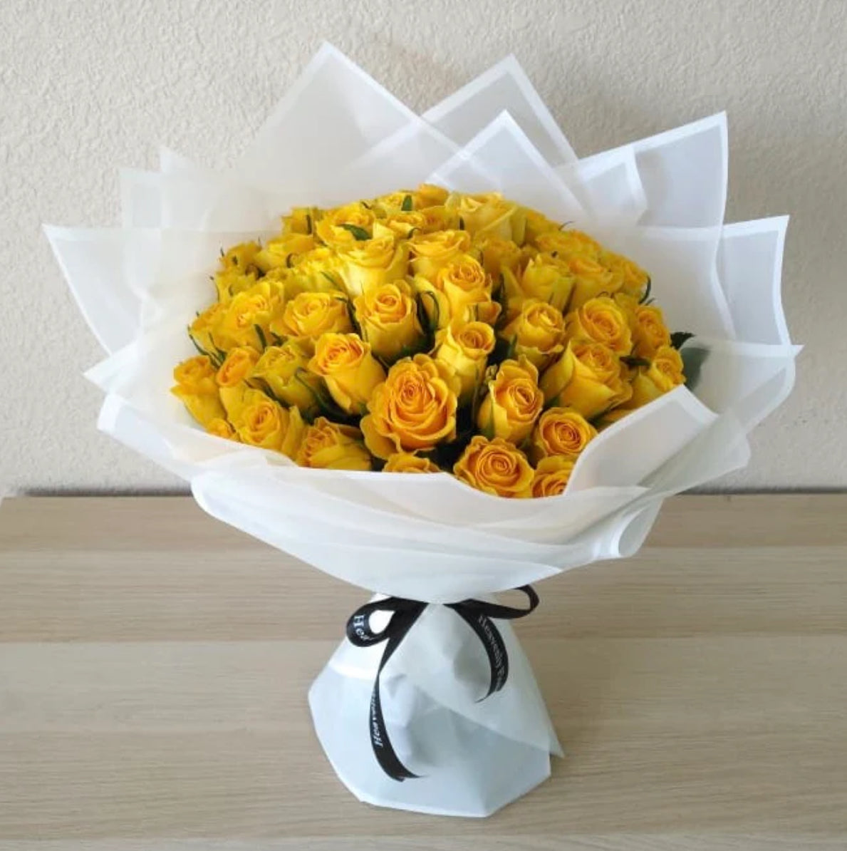 Bright yellow rose bouquet wrapped in elegant white paper – Golden Sunshine Bouquet by 1800 Blooms Bronx NY