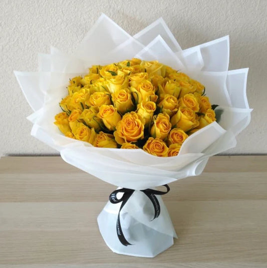 Bright yellow rose bouquet wrapped in elegant white paper – Golden Sunshine Bouquet by 1800 Blooms Bronx NY