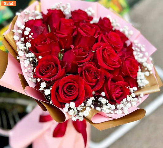 Bouquet of 12 red roses wrapped in blush and gold paper with baby’s breath – Passion in Bloom Bouquet by 1800 Blooms Bronx NY