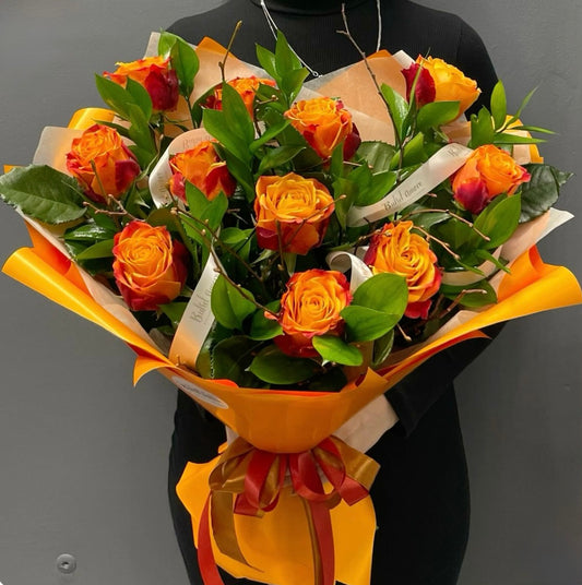 Vibrant sunset-inspired bouquet with orange roses, coral lilies, and golden daisies – Sunset Passion Bouquet by 1800 Blooms Bronx NY
